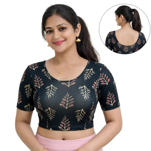 Woman wearing a black blouse with floral patterns on a white background