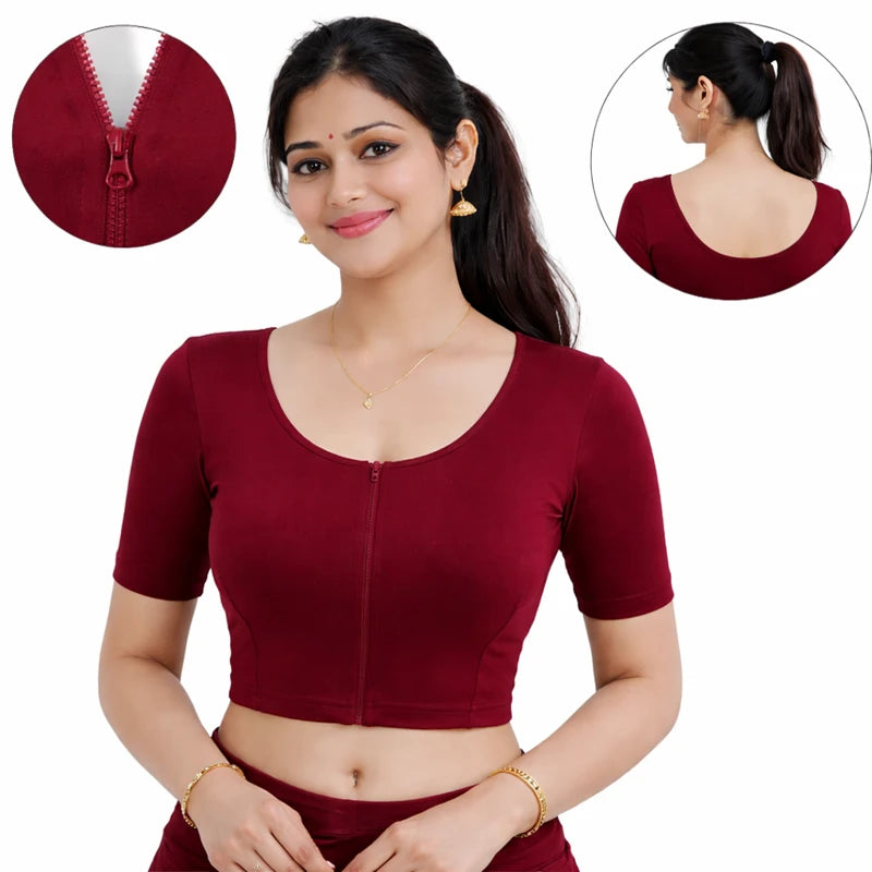 Woman wearing a maroon blouse with close-up insets of the zipper and neckline.